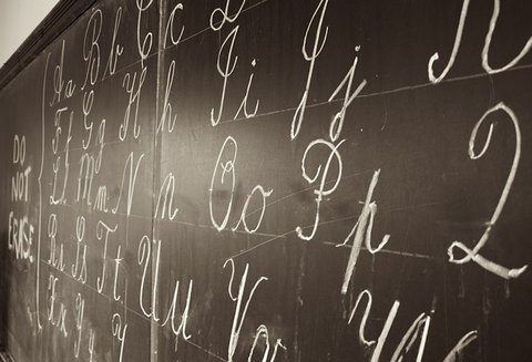 Cursive letters written on blackboard how to write in cursive